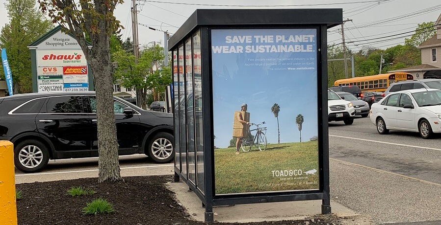 An ad for a sustainable clothing company. It's displayed on a bus shelter with advertising managed by ATA Outdoor.