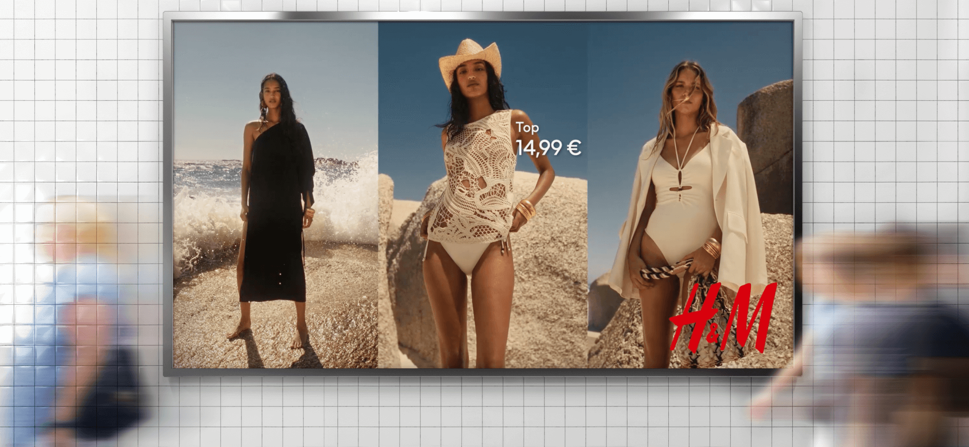 H&M digital out-of-home ad featuring models in summer fashion and swimwear, displayed in a busy transit environment.