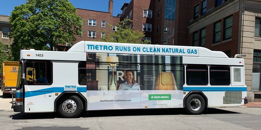 A bus showing an ad for Delta Dental on its side