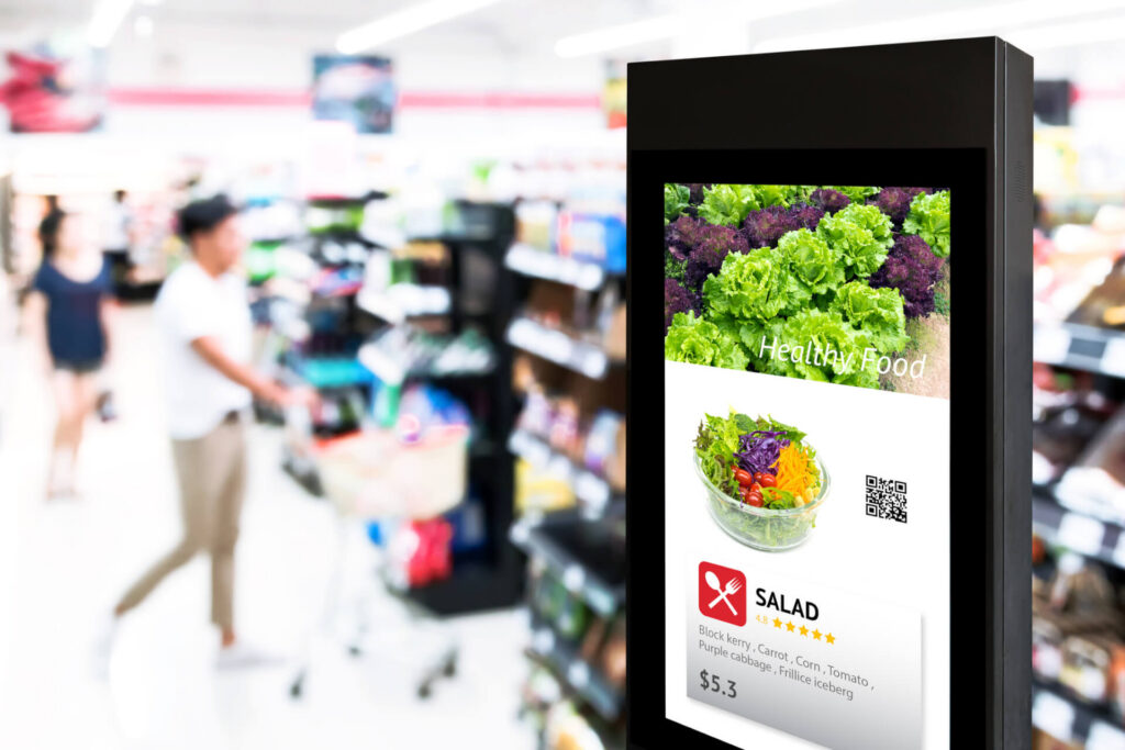 Digital grocery ad featuring fresh produce and everyday food items displayed beside a supermarket produce section.