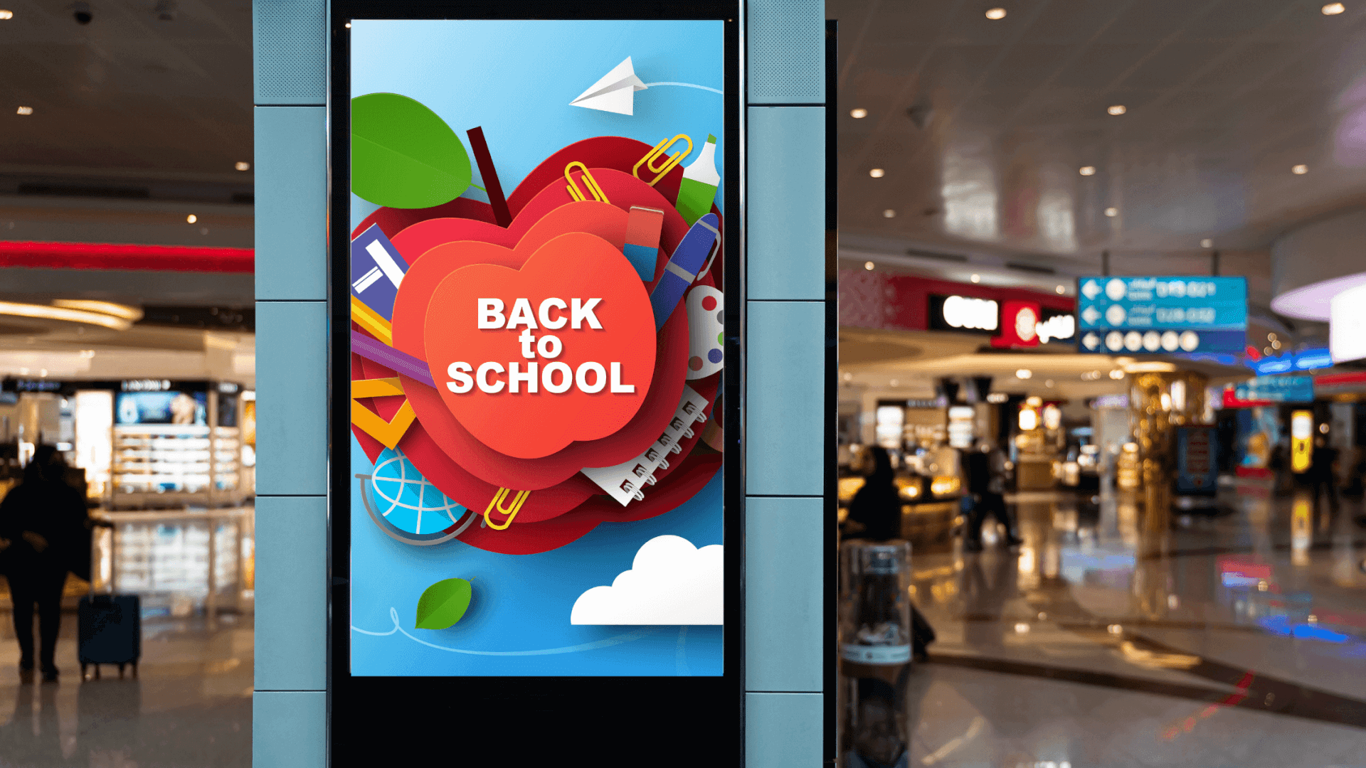Back-to-school digital out-of-home ad featuring colorful school supplies.