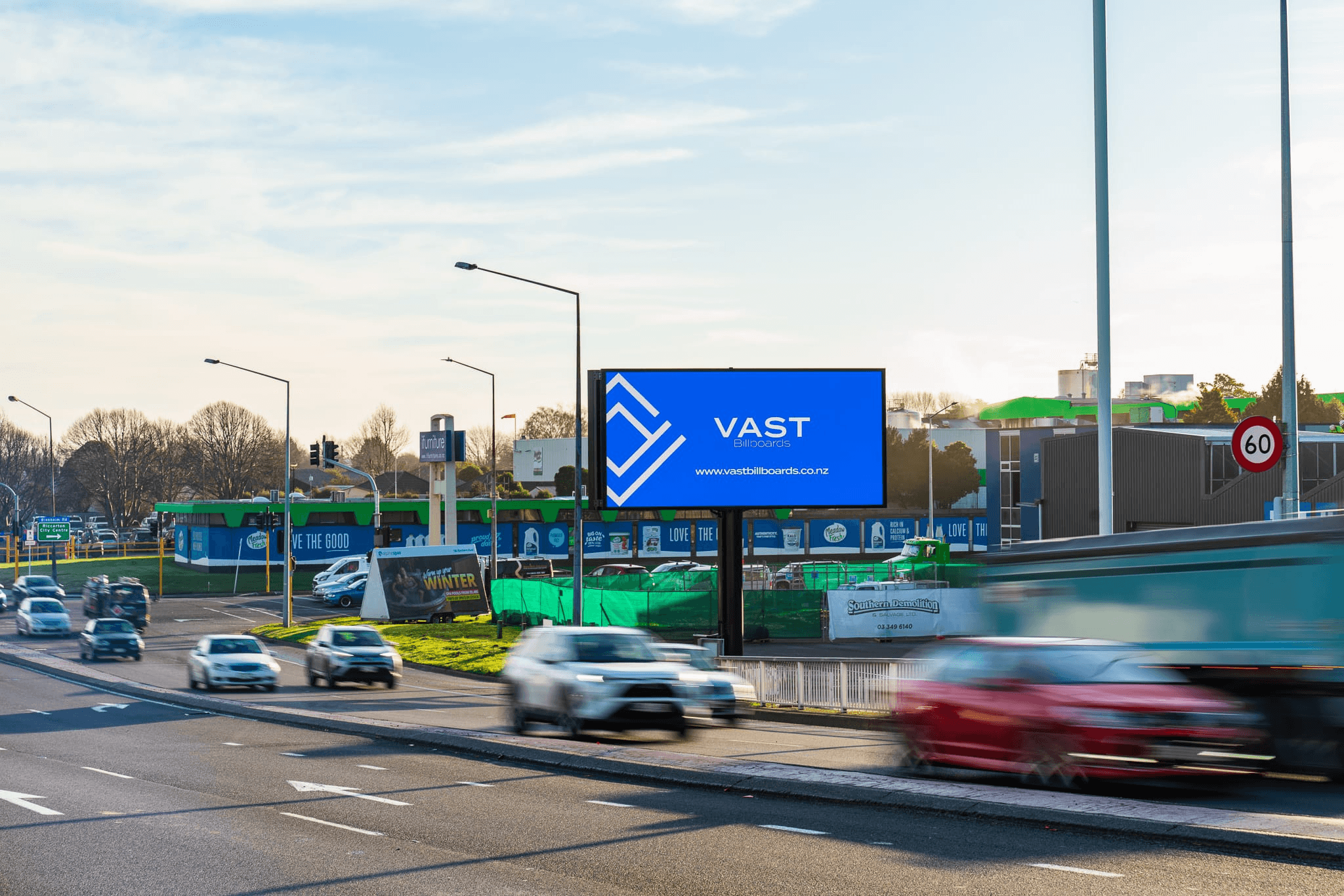 VAST digital billboard beside a busy roadway in Christchurch, New Zealand, displaying the VAST Billboards logo.