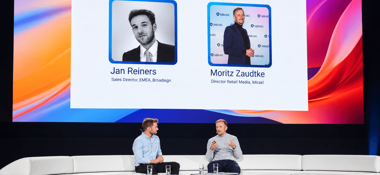 Jan Reiners, Sales Director EMEA at Broadsign, and Moritz Zaudtke, Director of Retail Media at Mirakl, discuss retail media onstage at a conference.